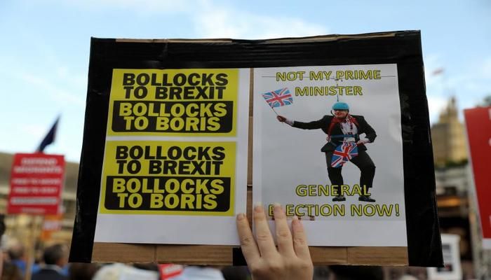 An anti-Brexit protesters holds a placard during a demonstration outside the Houses of Parliament, in London, Britain September 3, 2019. REUTERS