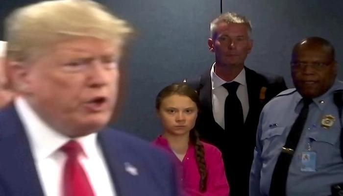 Swedish environmental activist Greta Thunberg watches as U.S. President Donald Trump enters the United Nations to speak with reporters in New York City, September 23, 2019. Thunberg angrily denounced world leaders at the U.N. Climate Action Summit for failing to tackle climate change, unleashing outrage felt by millions of her peers. "This is all wrong. I shouldn't be up here. I should be back in school on the other side of the ocean yet you all come to us young people for hope. How dare you?" said the 16-year-old. "You have stolen my dreams and my childhood with your empty words." Trump has questioned climate science and has challenged every major U.S. regulation aimed at combating climate change. REUTERS