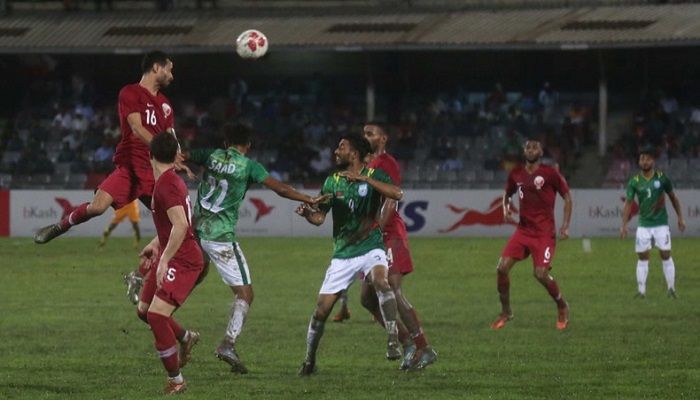 Qatar midfielder Boualum Khoukhi (L) heads the ball during their FIFA-AFC joint qualifiers match against Bangladesh at the Bangabandhu National Stadium on Thursday. Photo: Collected