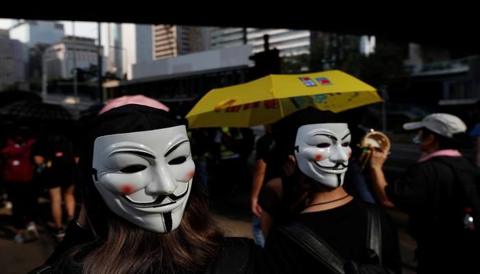 Anti-government protesters wearing masks attend a protest in central Hong Kong, China October 5, 2019. REUTERS