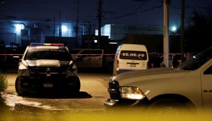 Police vehicles and a yellow police line cordon are pictured near at a crime scene after a journalist from National Geographic was shot in the leg late Friday while interviewing an alleged drug dealer, who was killed when four armed men stormed in on the interview, according to a statement from the Chihuahua State Attorney General's office, in Ciudad Juarez, Mexico Oct 4, 2019.  Photo: REUTERS