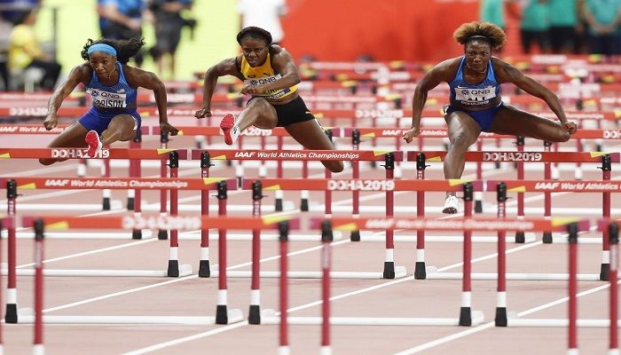 USA's Kendra Harrison (L), Jamaica's Danielle Williams (C) and USA's Nia Ali compete in the Women's 100m Hurdles final at the 2019 IAAF Athletics World Championships at the Khalifa International stadium in Doha on October 6, 2019. Photo: AFP