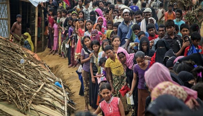 File Photo: Rohingyas who fled to Bnagladesh from Myanmar, wait in queues to recieve aid at Kutupalong refugee camp in Ukhiya, Bnagladesh. November 15, 2017. AP