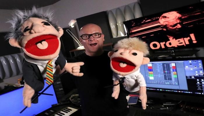 Belgian music producer Michael Schack, creator of the track `Order`, which mixes dance music with former speaker of British House of Commons John Bercow`s trademark ripostes, poses with puppets depicting Bercow and British Prime Minister Boris Johnson, in his studio in Antwerp, Belgium November 6, 2019. Photo: REUTERS