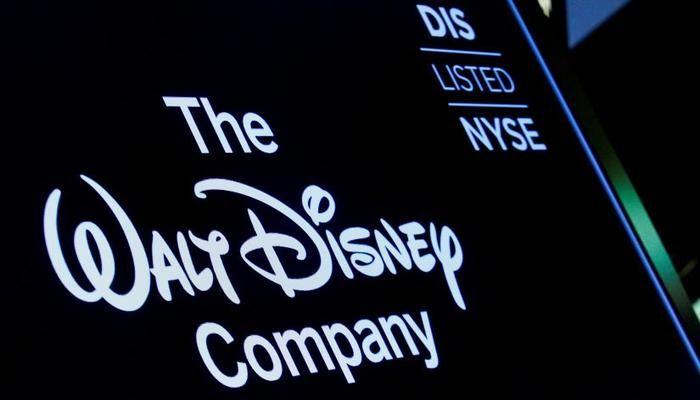 A screen shows the logo and a ticker symbol for The Walt Disney Company on the floor of the New York Stock Exchange (NYSE) in New York, U.S., December 14, 2017. Photo: REUTERS