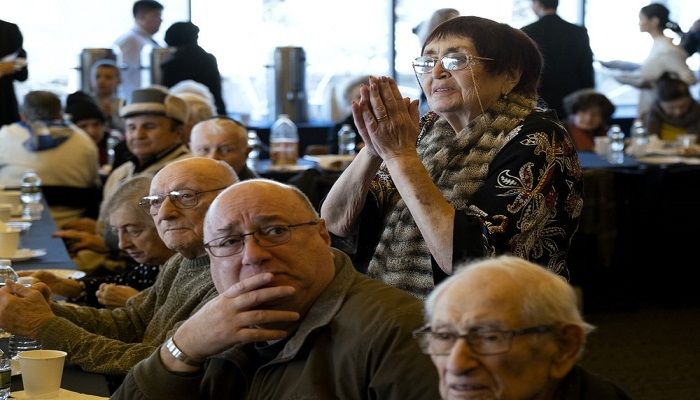 Survivors of the Holocaust and others listen to music as they gather at the Museum of Jewish Heritage in New York Sunday, Dec. 22, 2019, to recognize International Holocaust Survivors Night, one of several events held around the world. The event was held in conjunction with the Conference on Jewish Material Claims Against Germany (Claims Conference), developed to aid Jewish victims of Nazism. Photo: AP