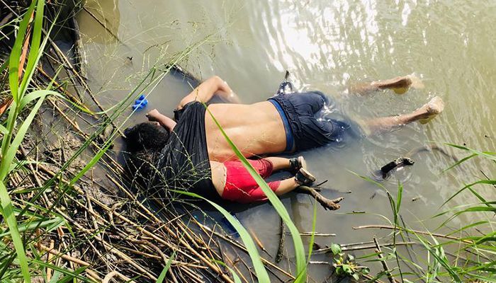 The bodies of Salvadoran migrant Oscar Alberto Martinez Ramirez and his daughter Valeria lie in the Rio Bravo river in Matamoros, Tamaulipas state, Mexico June 24, 2019. REUTERS