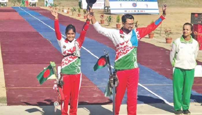 ANOTHER STAR IN THE MAKING: Ety Khatun, a 14-year old member of the gold-winning recurve women’s team, celebrates her success along with Bangladesh archery’s poster-boy Roman Sana after winning the gold medal in the recurve mixed team event in Pokhara yesterday. Photo: Collected File