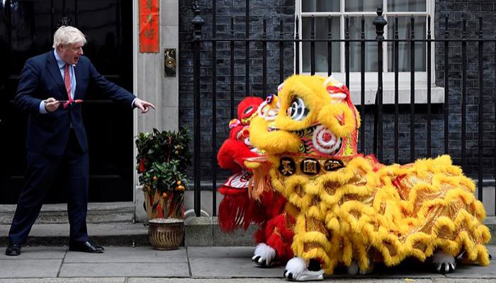 British Prime Minister Boris Johnson gestures as he watches a performance during celebrations for Lunar New Year at Downing Street in London, January 24, 2020. Photo: Reuters