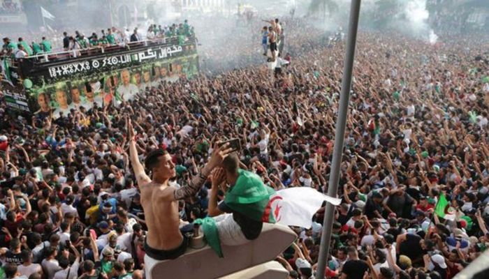 Algerians took a break from politics to celebrate the fact that the national football team won the Africa Cup of Nations title in July for the first time in 29 years by beating Senegal with 1-0. Photo: BBC