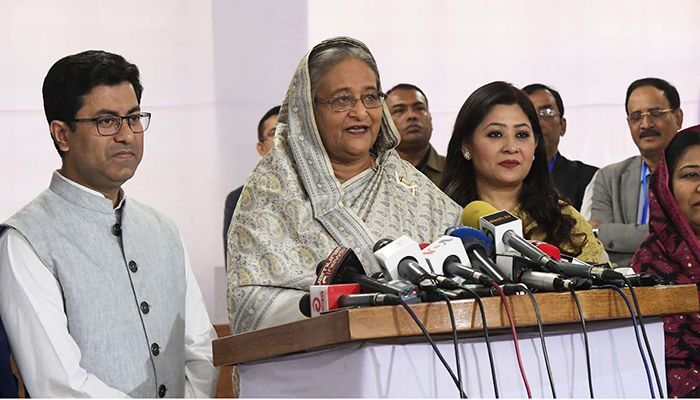 Prime Minister Sheikh Hasina talking to journalists after casting her vote in DCC polls at Dhaka City College polling centre. Photo: PID