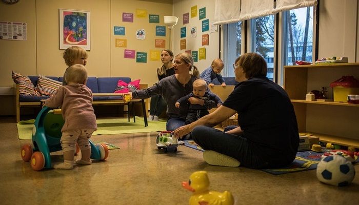 Parents and children play together at a day care centre in Kauniainen, Finland Nov 15, 2018. Photo: Collected from The New York Times