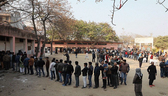 File Photo: Voters stand in queues as they wait to cast their vote outside a polling booth during the state assembly election, in Shaheen Bagh, New Delhi, India, February 8, 2020 Reuters