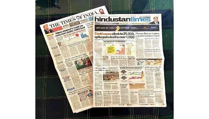 The front page of two mainline national dailies usually replete with revenue earring advertisements has news today, in New Delhi, India. Photo: Collected from AP 