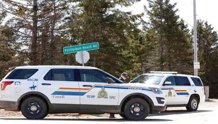 Royal Canadian Mounted Police (RCMP) block the entrance to Portapique Beach Road after they finished their search for Gabriel Wortman, who they describe as a shooter of multiple victims, in Portapique, Nova Scotia, Canada April 19, 2020. Photo: Collected from Reuters