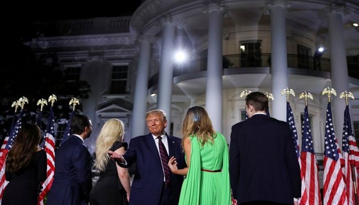 US President Donald Trump stands with First Lady Melania Trump, his son Barron and the rest of his extended family, after delivering his acceptance speech as the 2020 Republican presidential nominee. Mr Trump accepted his party's renomination from the South Lawn of the White House, during the final event of the Republican National Convention.