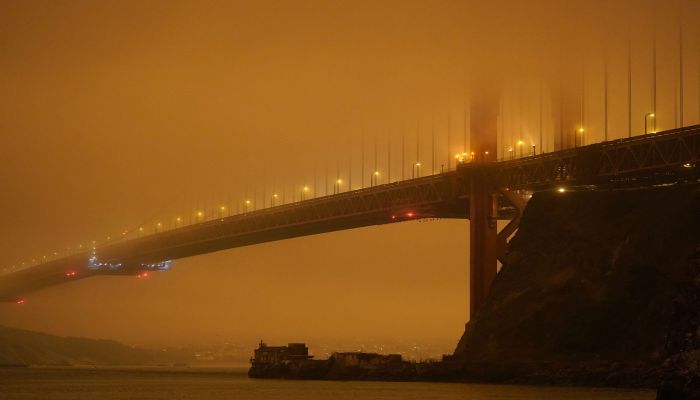 The Golden Gate Bridge is barely visible through smoke from wildfires on Wednesday morning, September 9, 2020, in this view from Fort Baker near Sausalito, California.