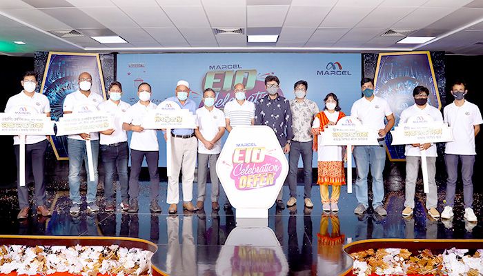 Photo: Marcel higher officials pose for a photograph with the placards of different customer benefits of the ‘Eid Celebration Offer,’ declared under the Digital Campaign Season-11 centering the upcoming Eid-ul-Azha. 