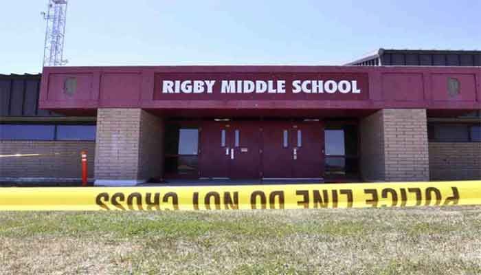 Police tape marks a line outside Rigby Middle School following a shooting there earlier Thursday, May 6, 2021, in Rigby, Idaho. Authorities said that two students and a custodian were injured, and a male student has been taken into custody. - UNB photo. 