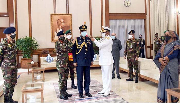 Quartermaster General SM Shafiuddin Ahmed and Assistant Chief of Naval Staff (Operations) Rear Admiral M Abu Ashraf adorned the air chief with the rank badge of Air Marshal. Photo: Collected 