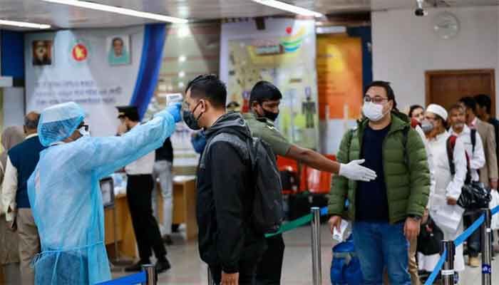 Passengers are checked with thermal scanner at the Hazrat Shahjalal International Airport as a preventive measure of Coronavirus in Dhaka, Bangladesh, March 11, 2020. || Photo: Reuters 