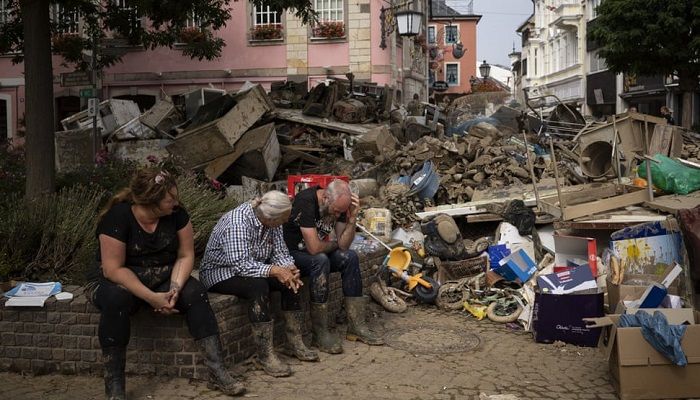 (Bad Neuenahr-Ahrweiler, Germany) Volunteers take time to rest while clearing up the debris of the flood disaster. (Photograph: Bram Janssen/AP)