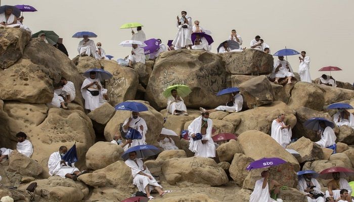 (Mecca, Saudi Arabia) Muslim pilgrims pray on top of the rocky hill known as the Mountain of Mercy on the Plain of Arafat during the annual hajj pilgrimage. (Photograph: Amr Nabil/AP)