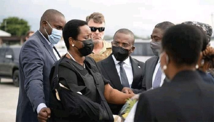 Haiti's first lady Martine Moise (L), the wife of assassinated President Jovenel Moise, is greeted by Haiti's interim Prime Minister Claude Jospeh, after arriving from the U.S, in Port-au-Prince, Haiti, in this undated photograph obtained by Reuters on July 17, 2021. || Reuters Photo: Collected