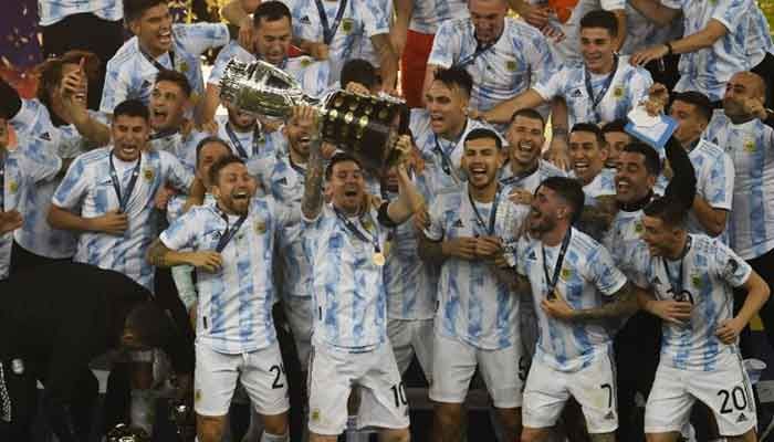 Argentina captain Lionel Messi lifts the trophy after winning the Conmebol 2021 Copa America final against Brazil at the Maracana Stadium in Rio de Janeiro on Saturday. || AFP photo: Collected