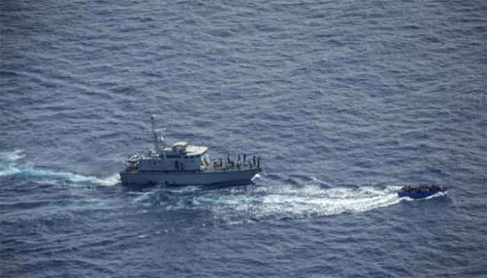 This handout aerial image taken on June 30, 2021 and released by German NGO Sea-Watch on July 1, 2021 shows Libyan coastguards (L) near a migrant boat in the Malta Search and Rescue Zone. || Photo: Collected 