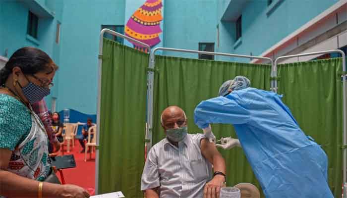 A man gets inoculated with a dose of Covishield vaccine against the Covid-19 coronavirus at a vaccination facility in Mumbai on July 10, 2021. ||Photo: AFP