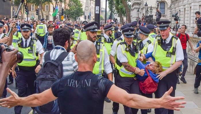 (London, UK) Police make an arrest in Whitehall during a protest against Covid vaccinations, passports and restrictions (Photo: Vuk Valcic)