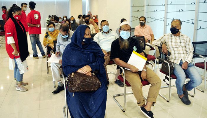 People waiting to receive Covid-19 vaccine doses at Bangabandhu Sheikh Mujib Medical University on June 26, 2021. || File Photo: Collected