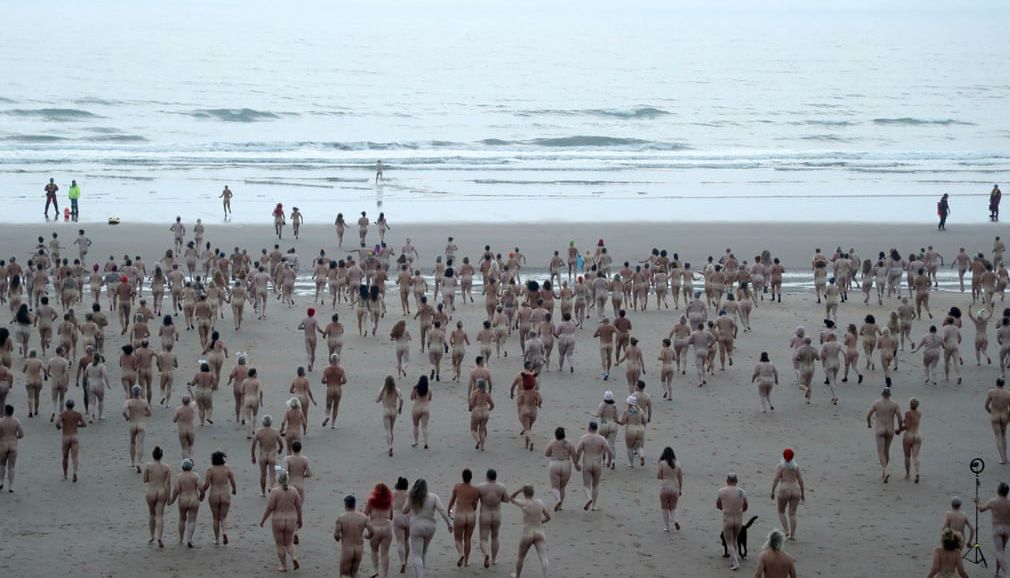 (Northumberland, UK) Participants in the annual North East Skinny Dip at Druridge Bay || Photograph: Scott Heppell/Reuters