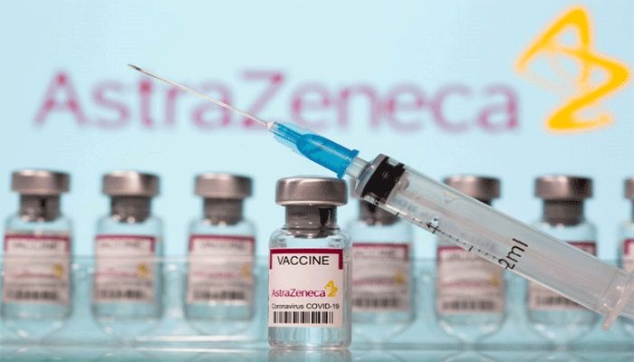 Vials labelled AstraZeneca Covid-19 vaccine and a syringe in front of an AstraZeneca logo in this illustration taken March 10, 2021. || Reuters Photo: Collected