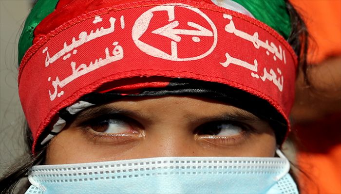 A girl wearing a protective face mask and the headband of the Popular Front for the Liberation of Palestine (PFLP) looks on during a rally to show solidarity with hunger-striking Palestinian prisoner Maher Al-Akhras, who is held by Israel, in Gaza City October 12, 2020. || Reuters Photo: Collected