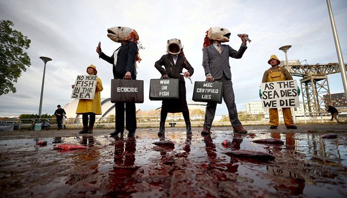 Glasgow, Scotland ||  Ocean Rebellion activists protest against destructive industrial fishing practices during the UN climate change conference. || Photograph: Hannah McKay/Reuters