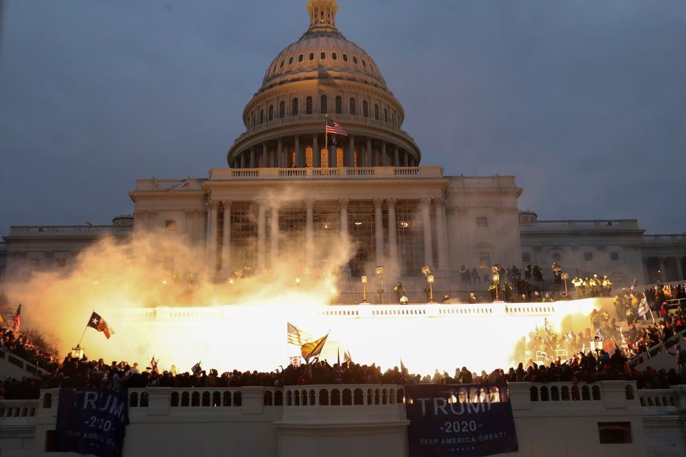 7th January 2021|| An explosion caused by a police munition is seen while supporters of U.S. President Donald Trump gather in front of the U.S. Capitol Building in Washington, U.S || Leah Millis/Reuters