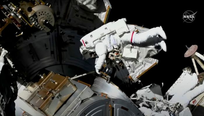 Astronauts conduct a spacewalk to replace a faulty antenna on the International Space Station (ISS) in a still image from video December 2, 2021. || Reuters Photo: Collected  
