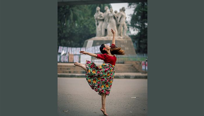 In the viral photos, Mubasshira Kamal Era was seen in a flying mood in front of Raju Memorial Sculpture at the varsity campus.