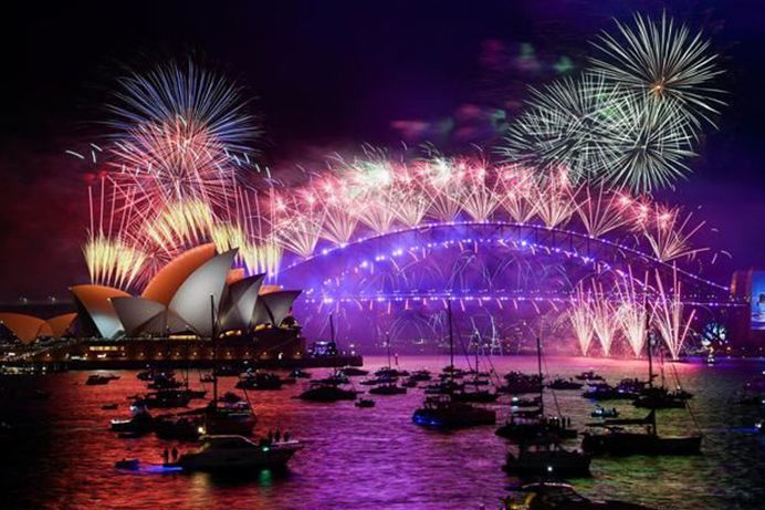 Sydney's iconic Harbor Bridge and Opera House in Australia, with fireworks and lights flashing in the early hours of the new year || Photo: Reuters