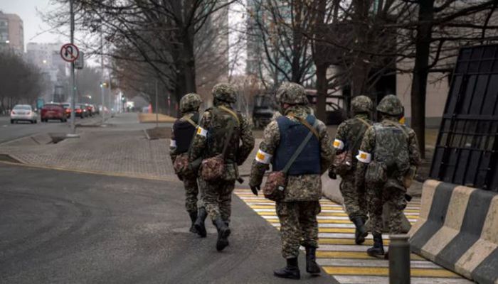 Kazakh soldiers patrol down a street in Almaty on January 10, 2022, after the violence that erupted following protests over hikes in fuel prices. || AFP Photo: Collected 