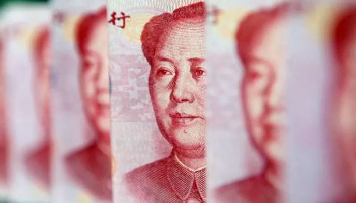 Yuan banknotes are seen in this illustrative photograph taken in Beijing on July 26, 2010. || Reuters Photo: Collected  