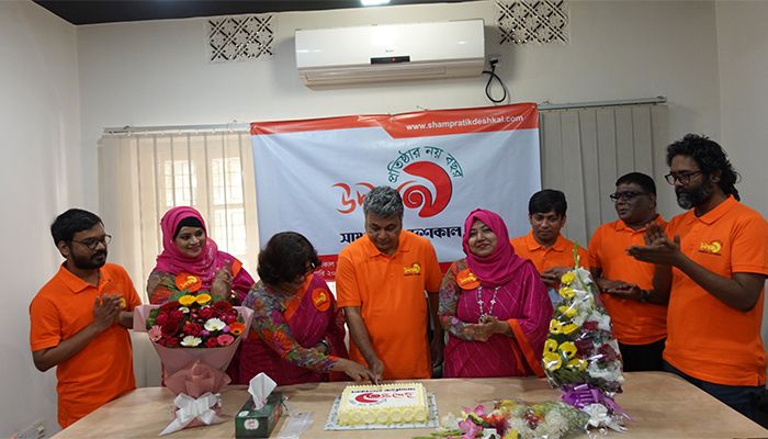 Shampratik Deshkal Editor Eliash Uddin Palash with other senior team members cut the cake.