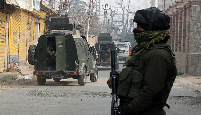 Indian Army soldiers stand guard on the outskirts of Srinagar on December 13, 2021, after two suspected militants were killed in a gunfight with security forces, police said AFP  