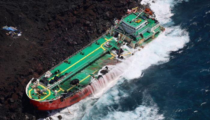 An aerial view taken on February 11, 2022 shows the Mauritian oil tanker Tresta Star, stranded off the coast of Reunion Island, at Le Tremblet, place of the 2007 lava flow, near Saint-Philippe, after the Batsirai cyclone hit Madagascar and the area on February 6. The emptying of the fuel tanks continues on February 11, 2022 on the Mauritian ship stranded in Saint-Philippe || AFP Photo: Collected 