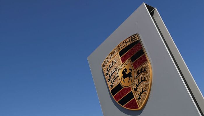 A logo of Porsche is seen outside a Porsche car dealer, amid the coronavirus disease (Covid-19) outbreak in Brussels, Belgium May 28, 2020. || Reuters Photo: Collected   