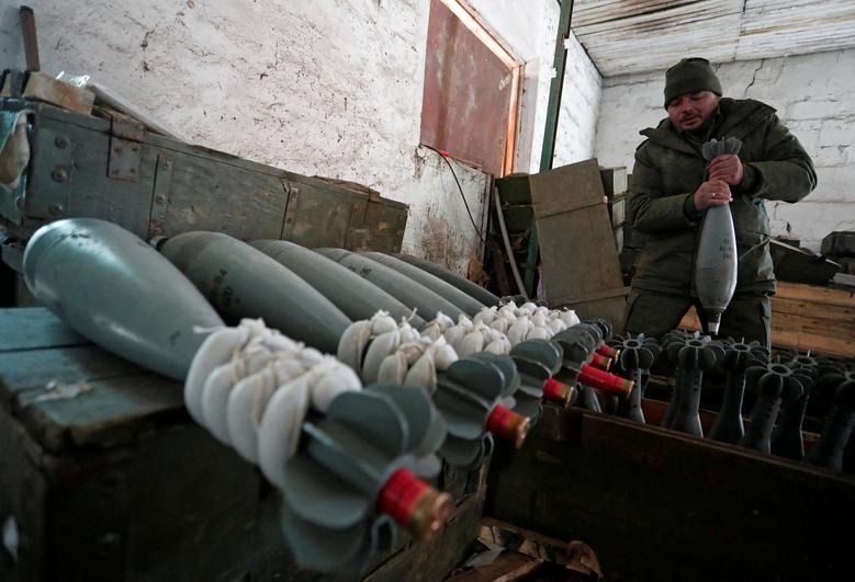 A member of the pro-Russian army inspects a mortar at an arms depot near Mariinka in the Donetsk region of Ukraine || Photo: Reuters