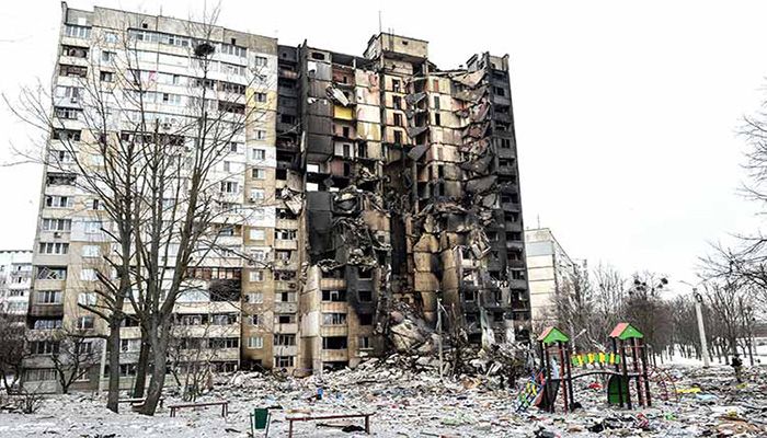 This picture shows an apartment building damaged after Russian shelling. AFP Photo