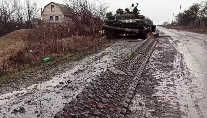This screen grab obtained from a handout video released by the Russian Defence Ministry on March 4, 2022, shows a destroyed Ukrainian army tank in the settlement of Gnutovo outside Mariupol || AFP Photo: Collected  